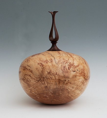 Hollow form turned from Buckeye Burl, with African Blackwood outlet finial