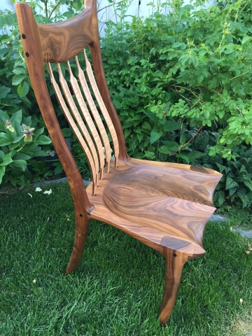 Hand sculpted walnut chair
