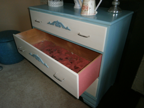 Painted sides and inside drawers in contrasting color and lined with floral design clear window film